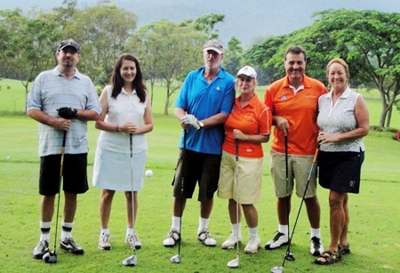 The girls and their partners get some early practice in at Soi Dao Highlands Golf Resort.